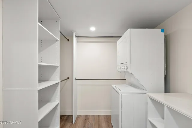 a view of storage and utility room with washer and dryer