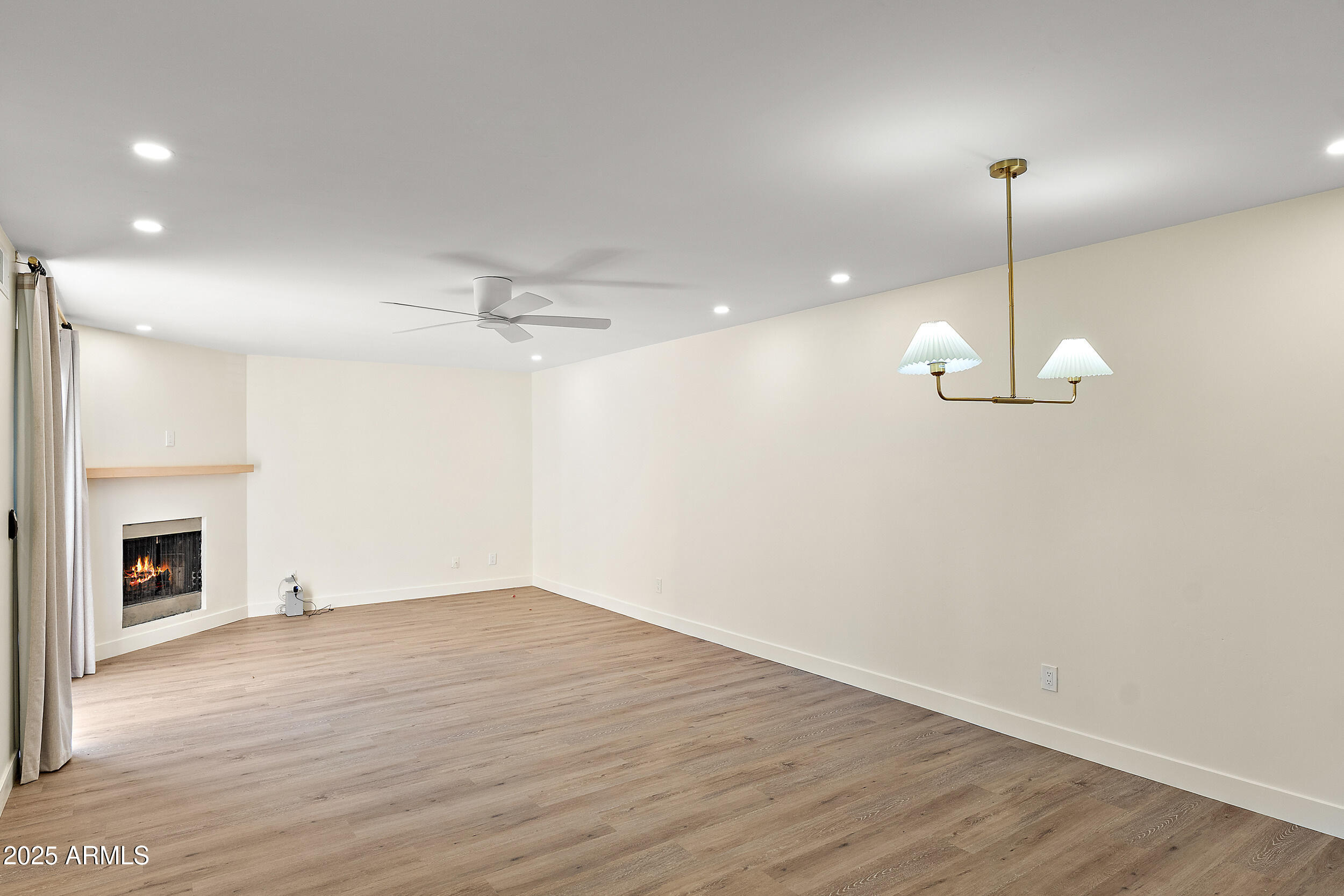 1319 East Susan Lane Tempe, AZ 85288 - Photo 7 of 23 a view of a room with wooden floor fireplace and window