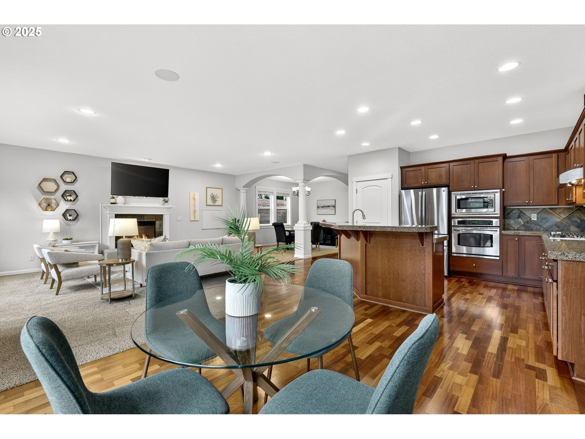 13140 Southwest Madison Court Beaverton, OR 97008 - Photo 14 of 48 a dining room with furniture a dining table and kitchen view