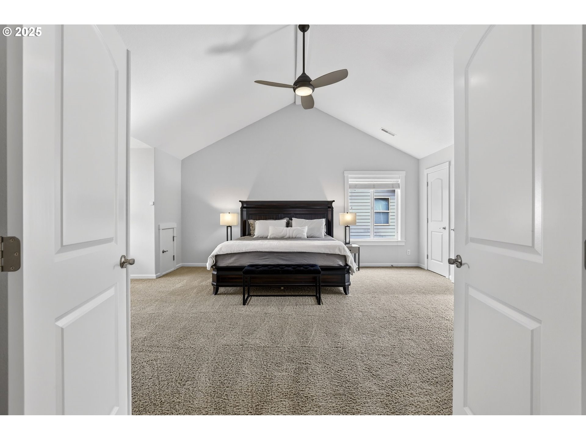 13140 Southwest Madison Court Beaverton, OR 97008 - Photo 25 of 48 a bedroom with a bed and a ceiling fan