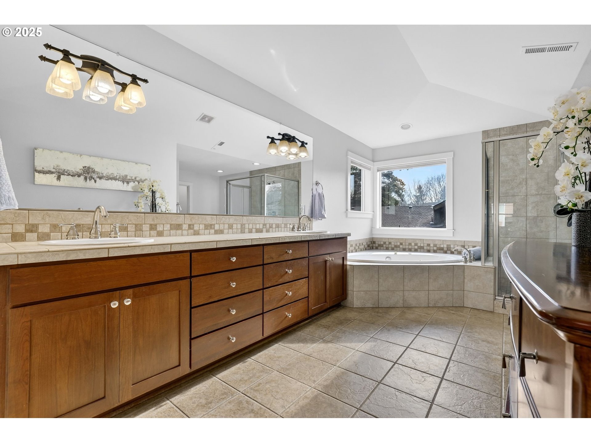 13140 Southwest Madison Court Beaverton, OR 97008 - Photo 30 of 48 a bathroom with a granite countertop double vanity sink a mirror and a bathtub