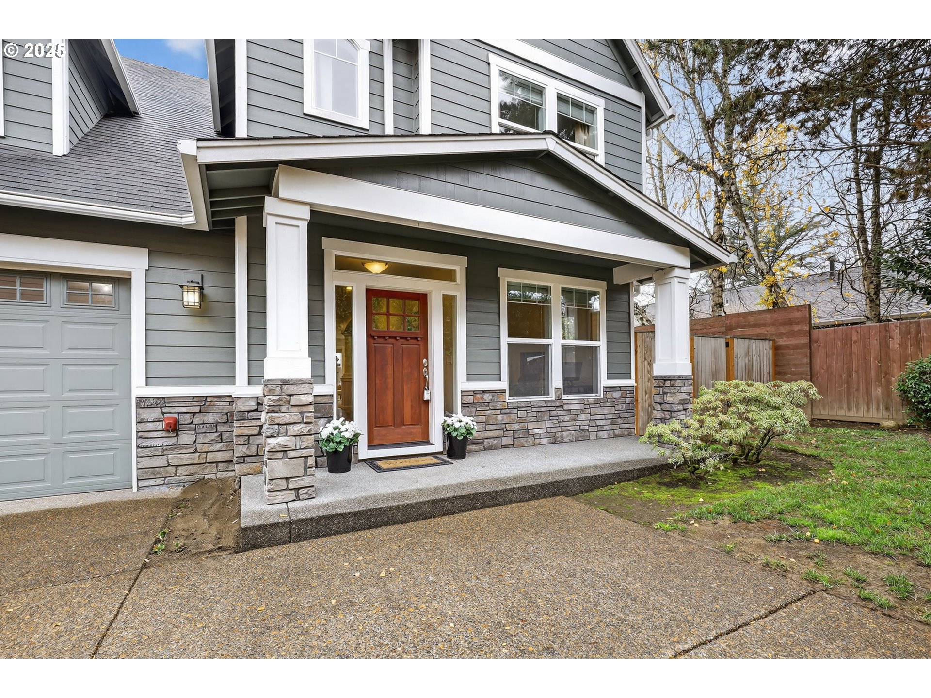 13140 Southwest Madison Court Beaverton, OR 97008 - Photo 3 of 48 a front view of a house with garden