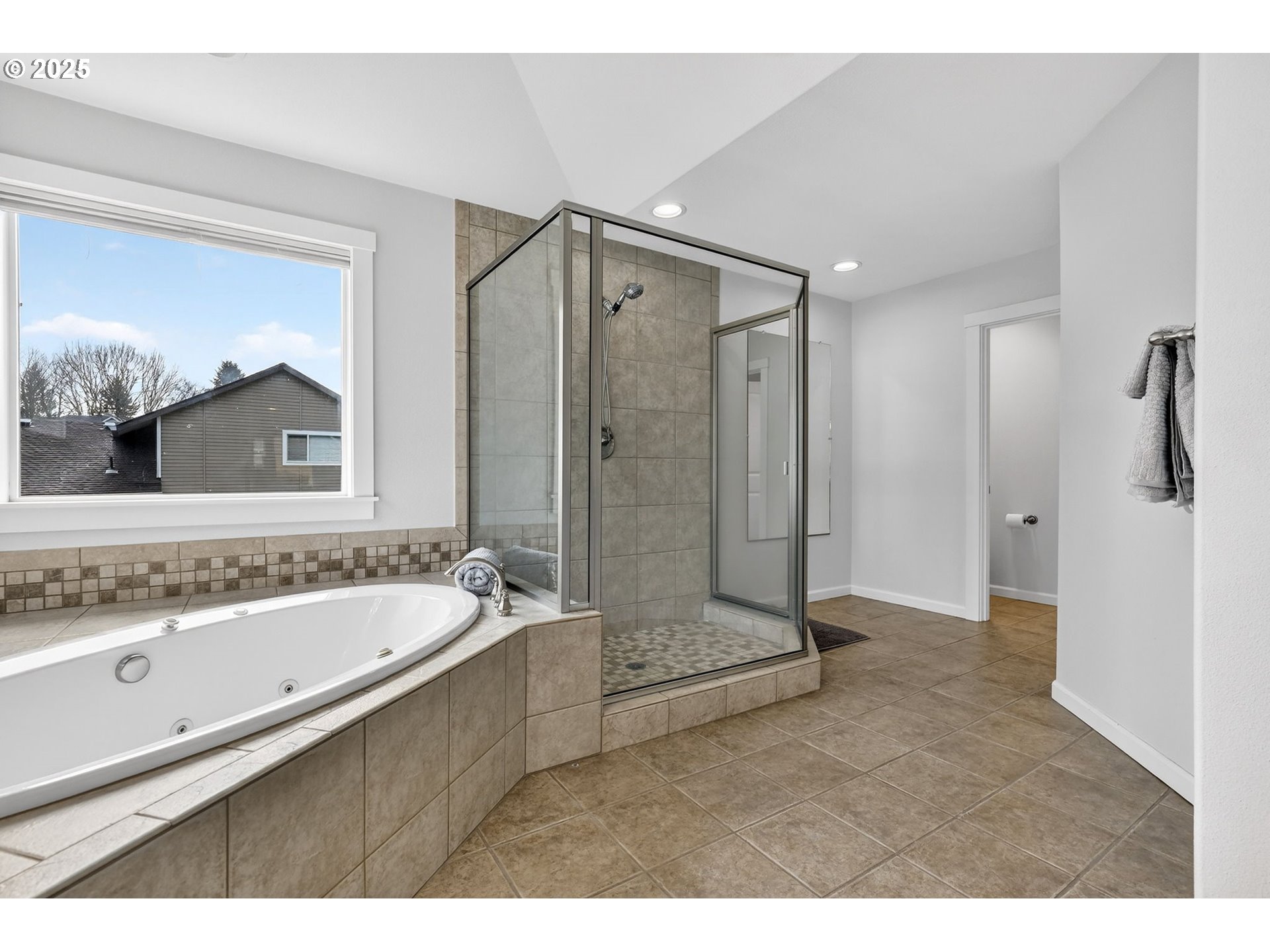 13140 Southwest Madison Court Beaverton, OR 97008 - Photo 31 of 48 a bathroom with a tub a sink and mirror