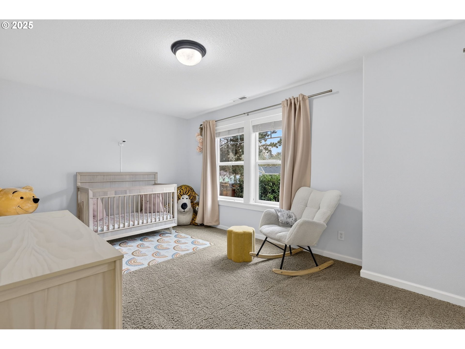 13140 Southwest Madison Court Beaverton, OR 97008 - Photo 34 of 48 a living room with a baby crib furniture and a window