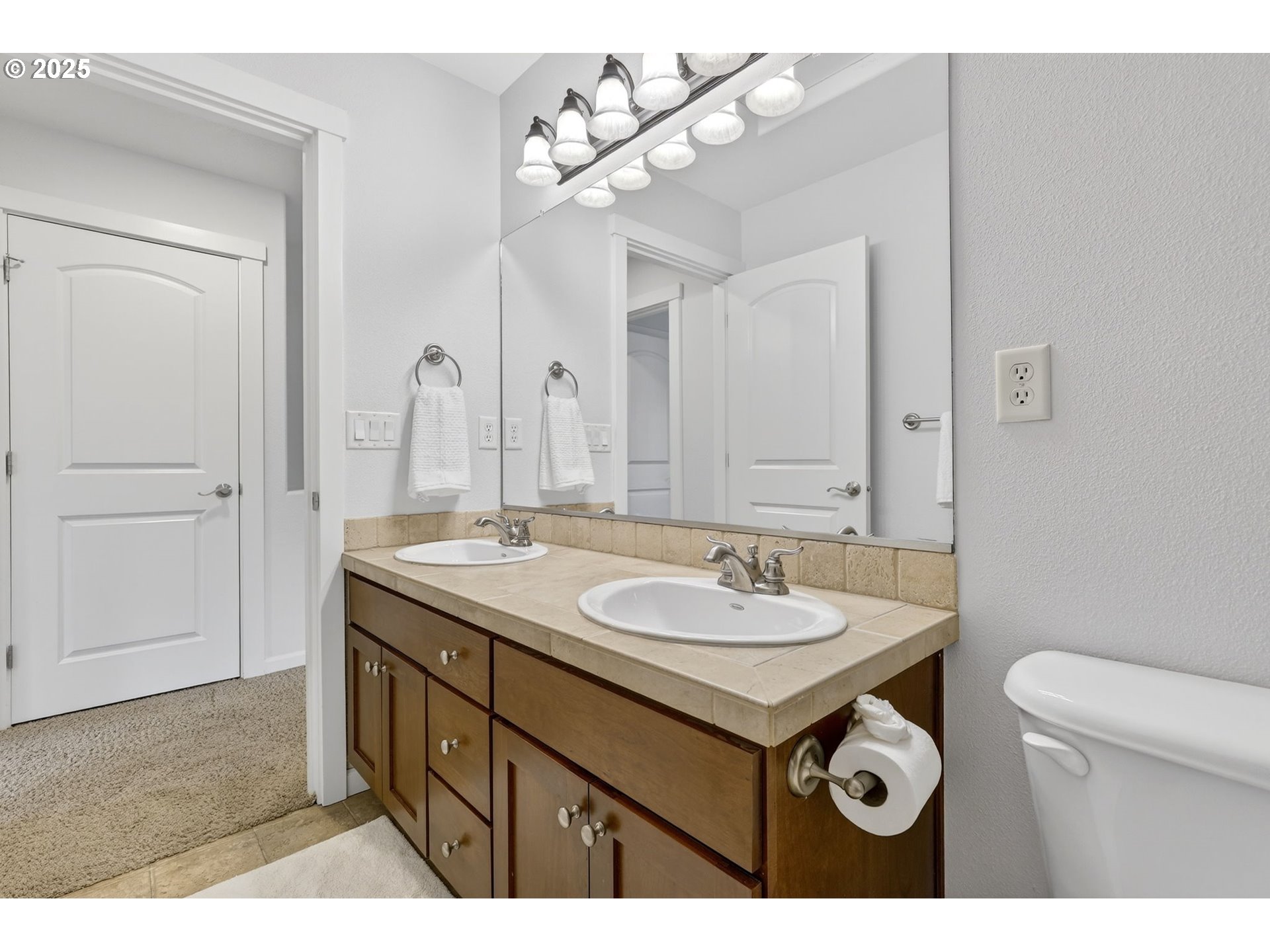 13140 Southwest Madison Court Beaverton, OR 97008 - Photo 36 of 48 a bathroom with a sink a mirror and a toilet