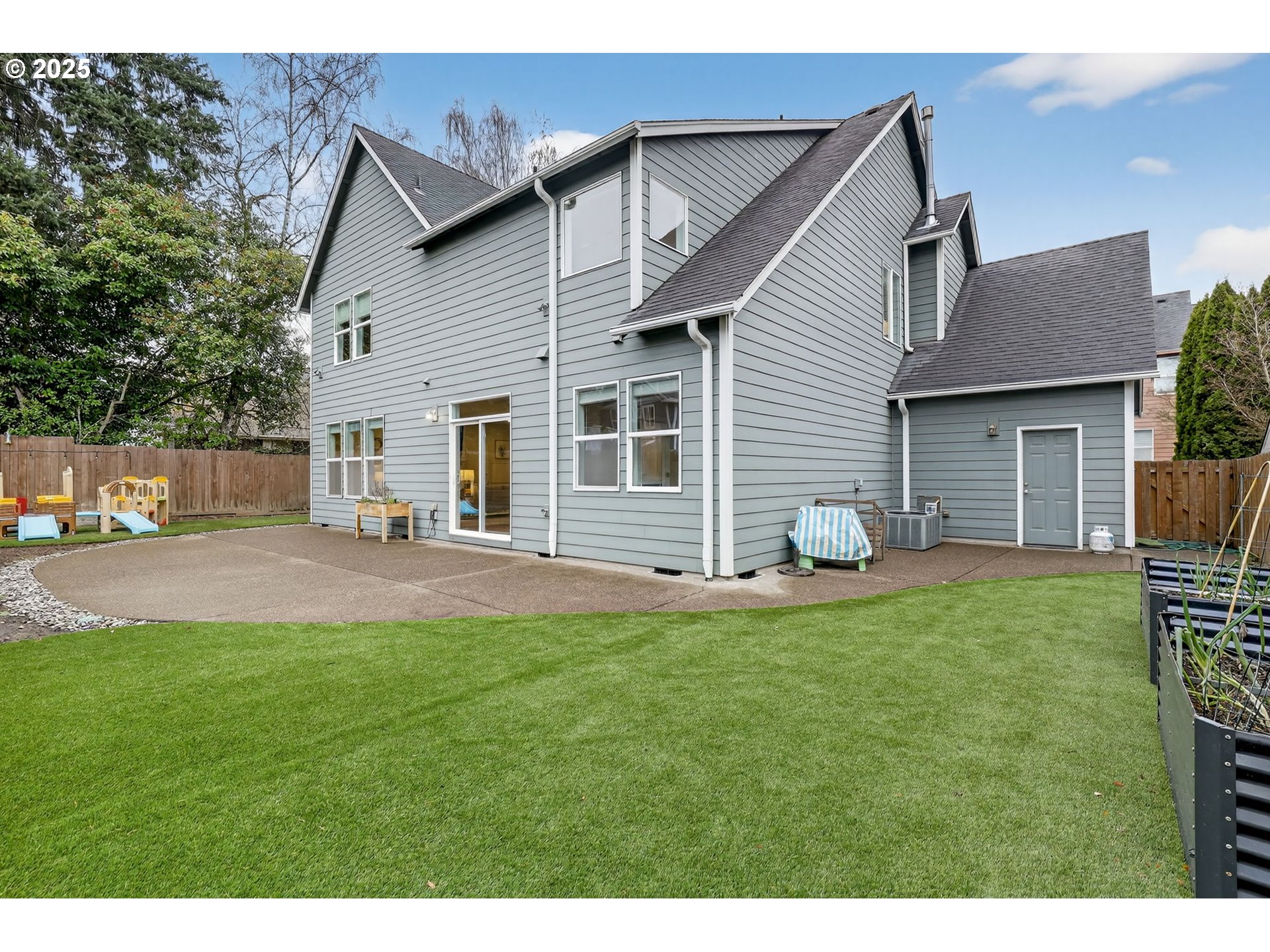 13140 Southwest Madison Court Beaverton, OR 97008 - Photo 38 of 48 a view of a house with a patio and a yard
