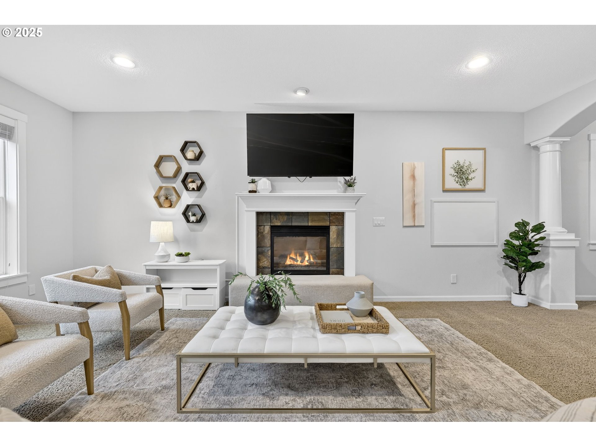 13140 Southwest Madison Court Beaverton, OR 97008 - Photo 10 of 48 a living room with furniture a flat screen tv and a fireplace