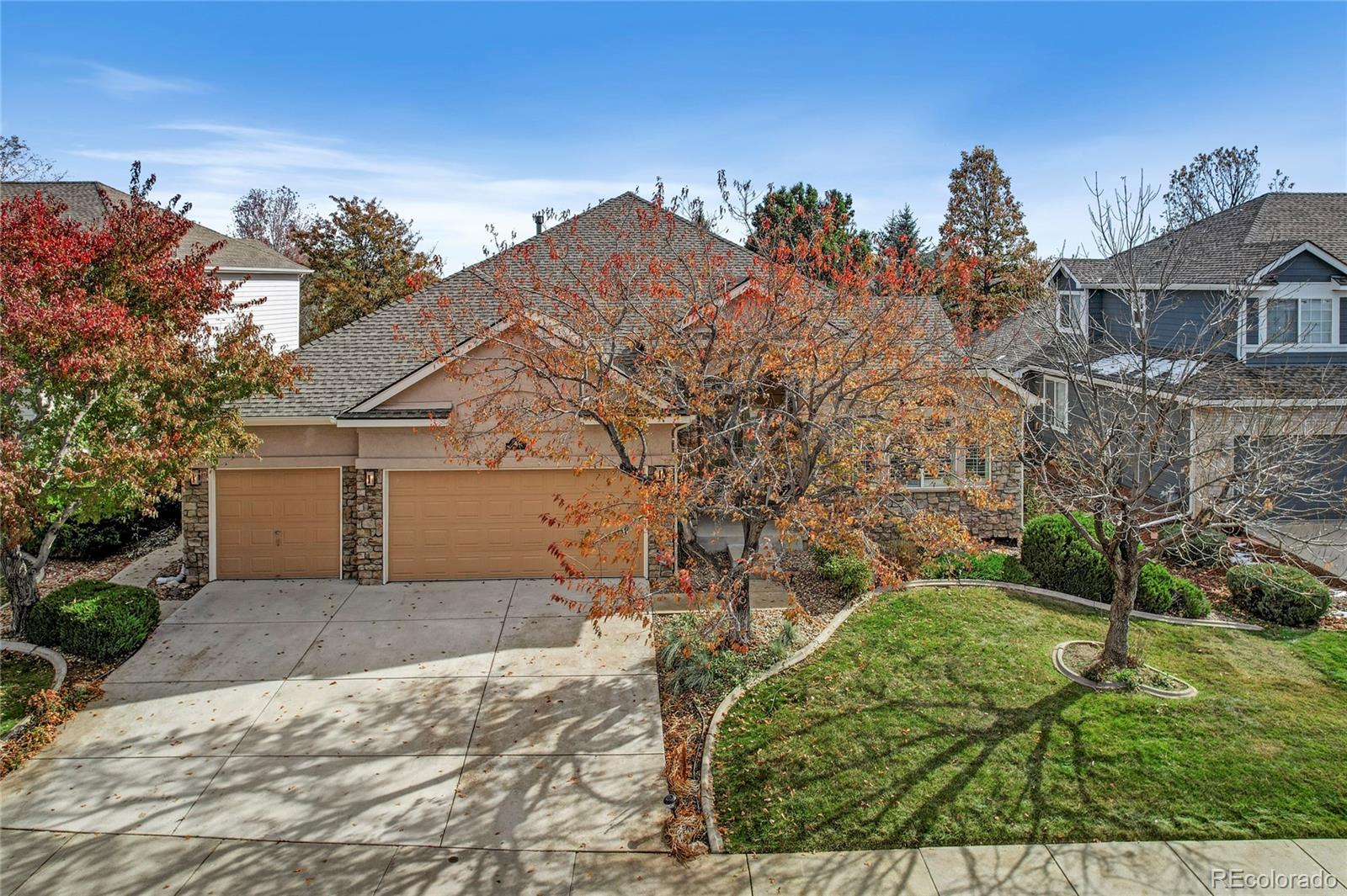 front view of a house with a yard