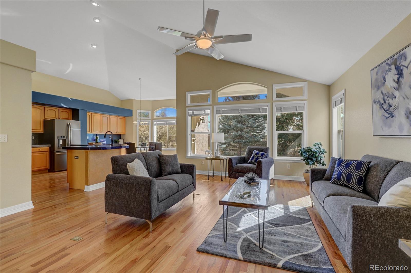 13810 Muirfield Circle Broomfield, CO 80023 - Photo 11 of 45 a living room with furniture and a large window
