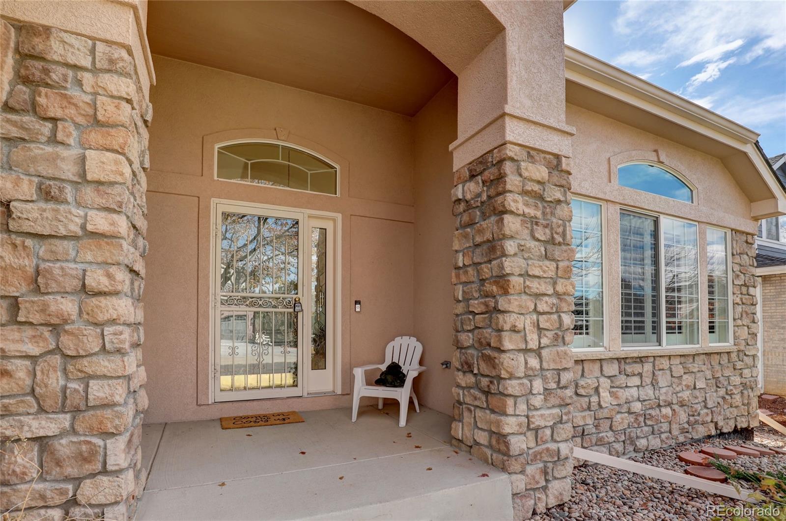 13810 Muirfield Circle Broomfield, CO 80023 - Photo 2 of 45 a front view of a house with a large window