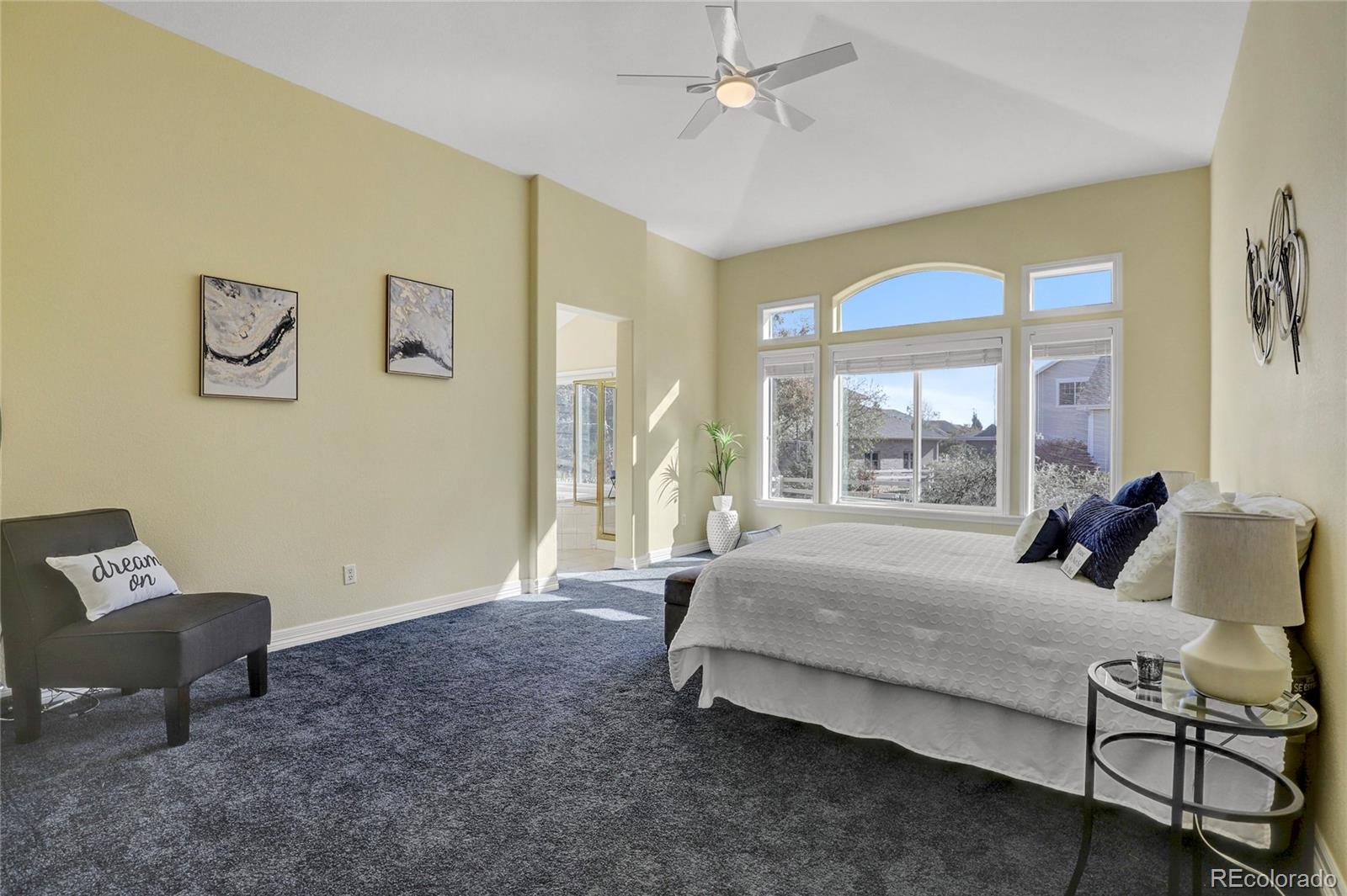 13810 Muirfield Circle Broomfield, CO 80023 - Photo 21 of 45 a bedroom with a bed and wooden floor