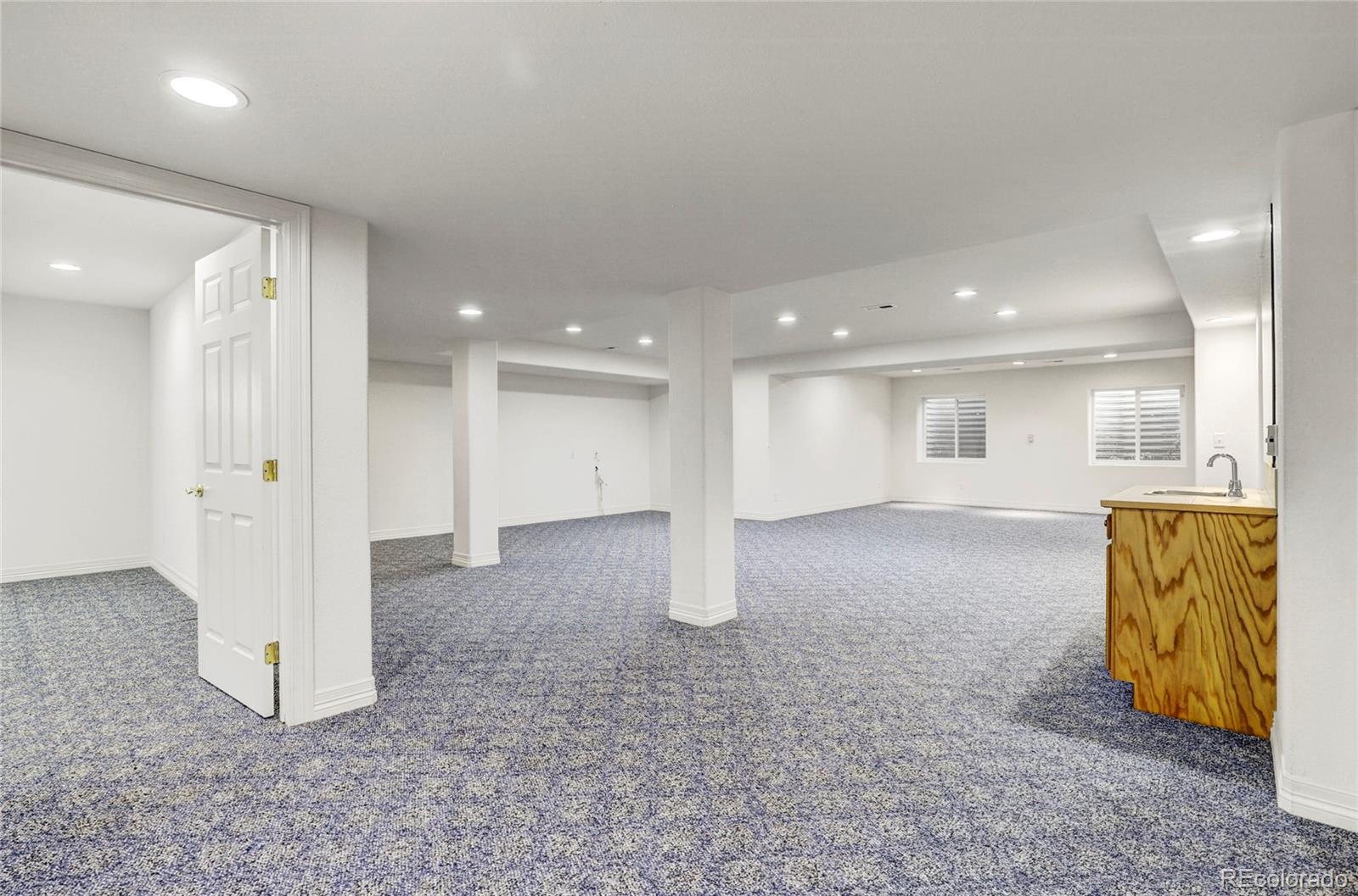 13810 Muirfield Circle Broomfield, CO 80023 - Photo 35 of 45 a view of an empty room and a kitchen