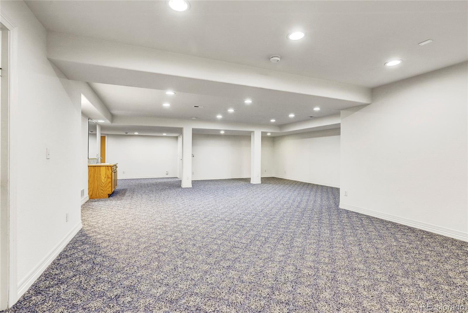 13810 Muirfield Circle Broomfield, CO 80023 - Photo 37 of 45 an empty room with a natural light