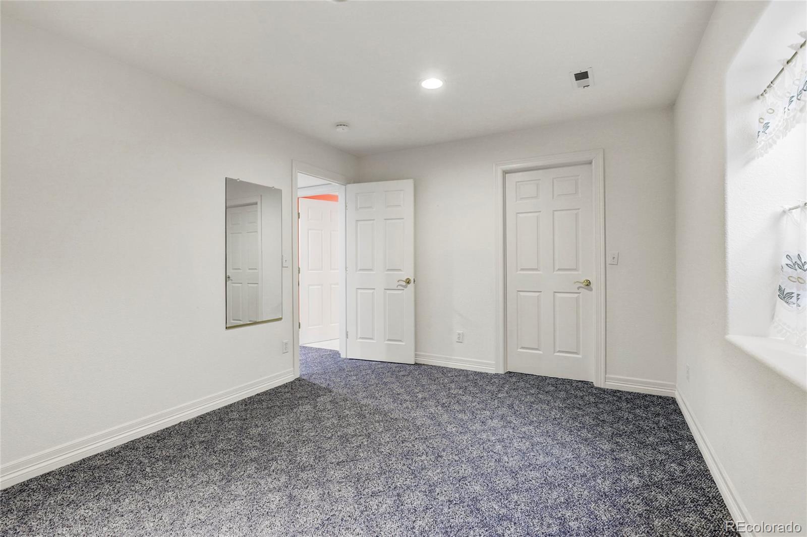 13810 Muirfield Circle Broomfield, CO 80023 - Photo 39 of 45 a view of an empty room and window