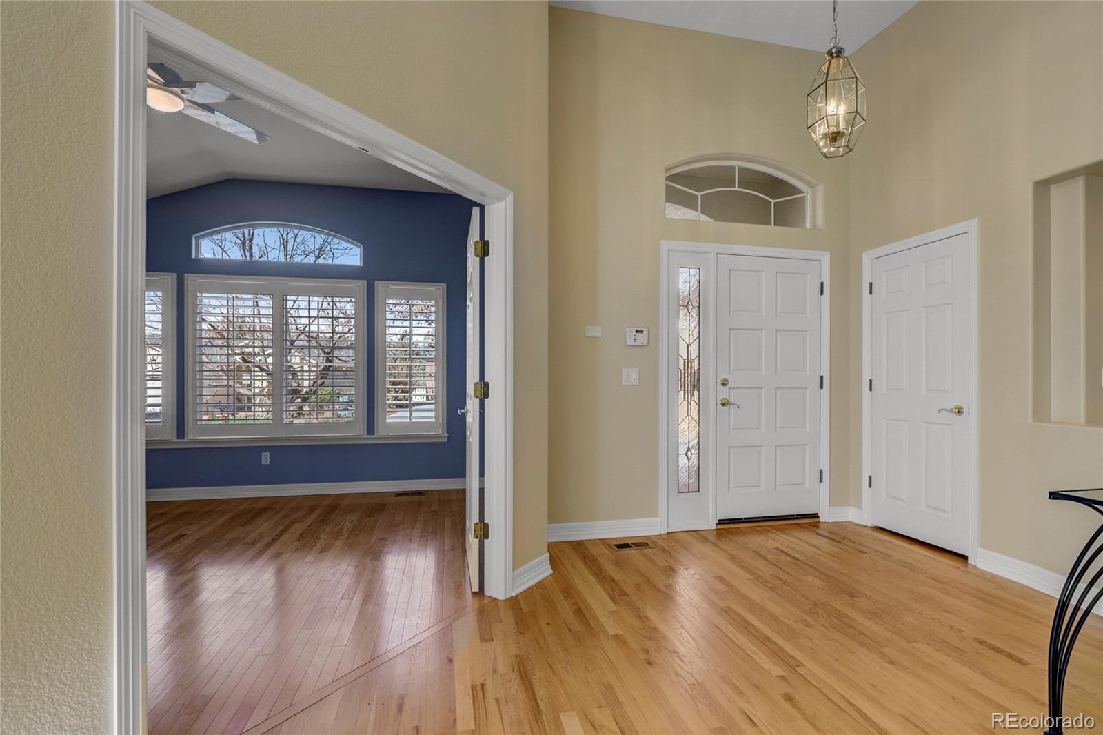 13810 Muirfield Circle Broomfield, CO 80023 - Photo 4 of 45 a view of empty room with wooden floor and fan