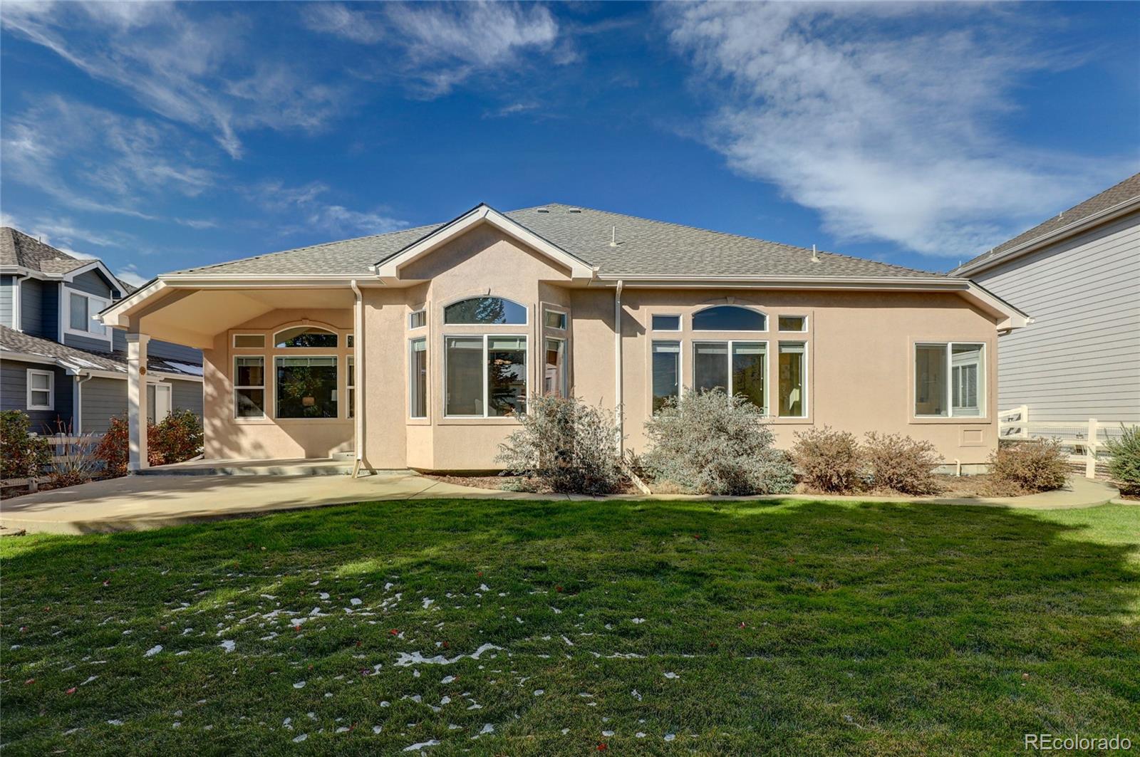 13810 Muirfield Circle Broomfield, CO 80023 - Photo 44 of 45 a front view of a house with a garden