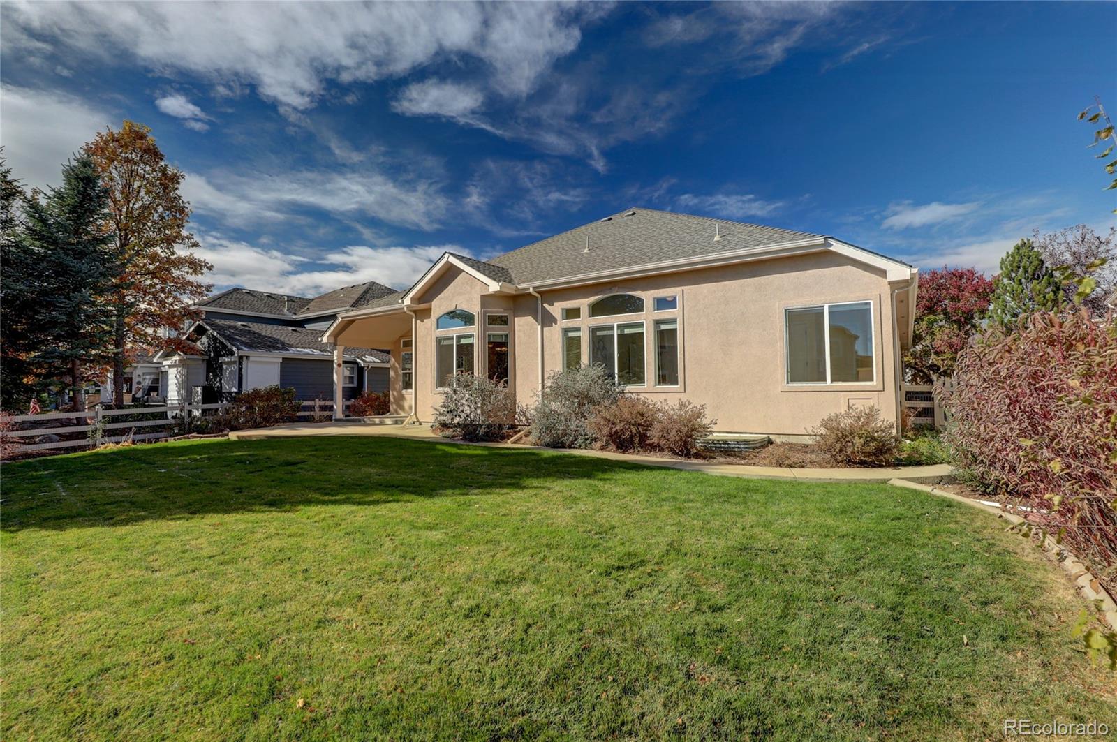 13810 Muirfield Circle Broomfield, CO 80023 - Photo 45 of 45 a front view of a house with a yard