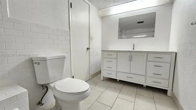 a bathroom with a toilet and a bathtub