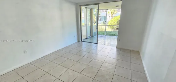 a view of an empty room and window