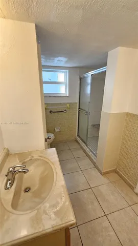 a bathroom with a toilet and a sink