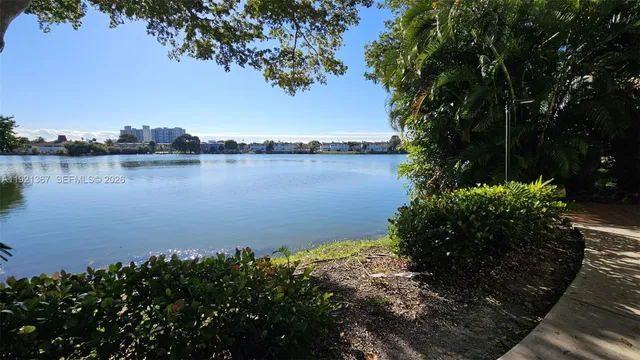 a balcony with tall trees