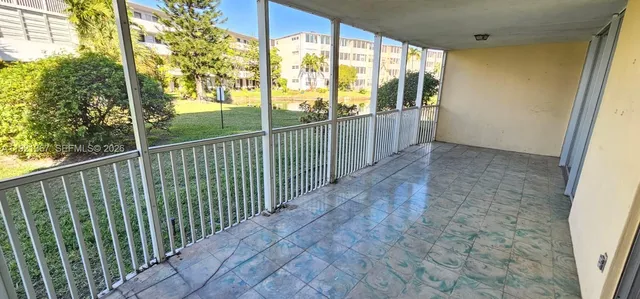 a kitchen that has a sink and a stove in it