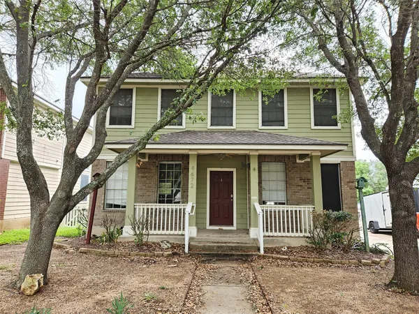 a front view of a house with a porch