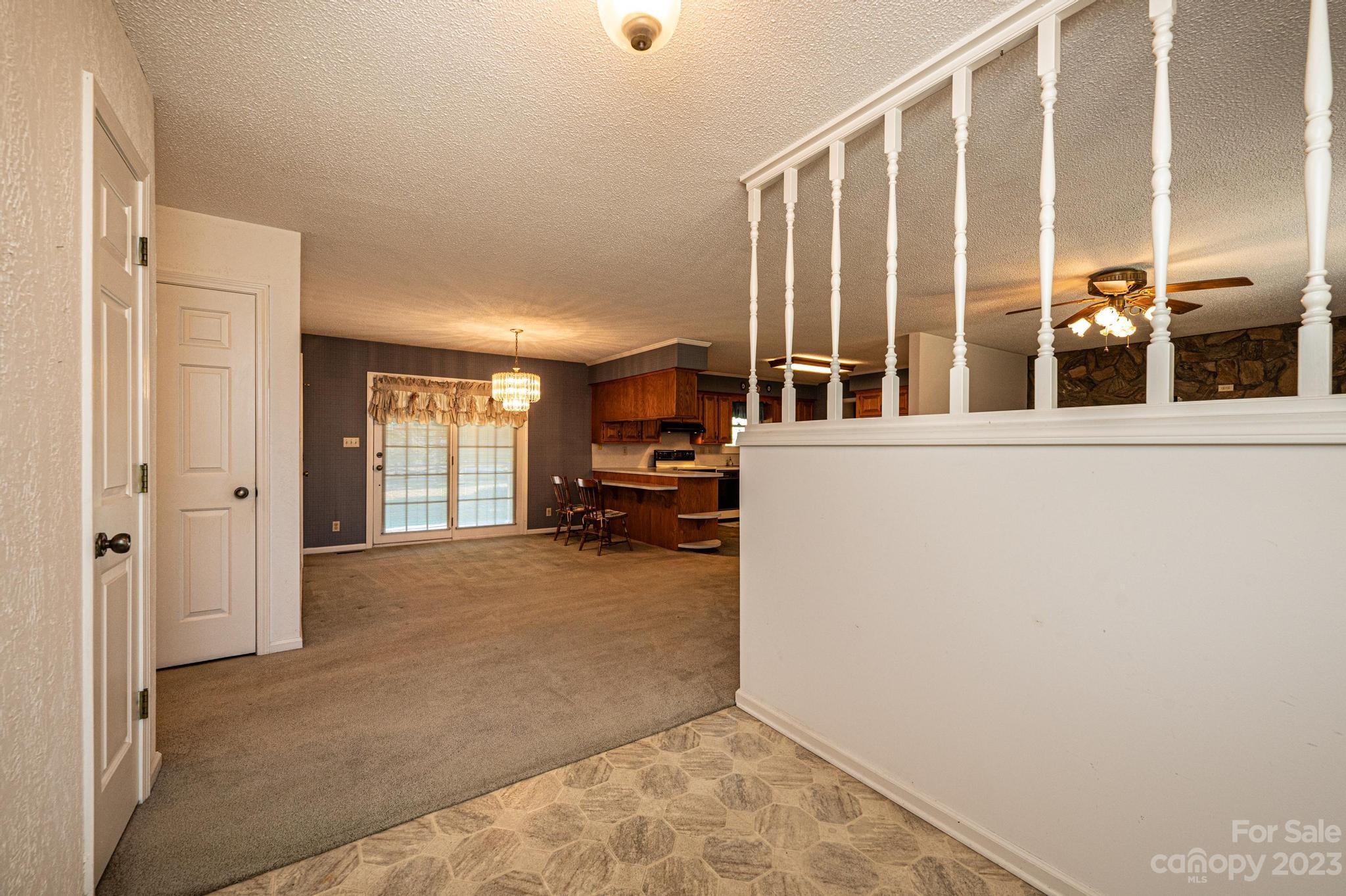 837 White Plains Road Hiddenite, NC 28636 - Photo 11 of 46 a view of a living room with furniture
