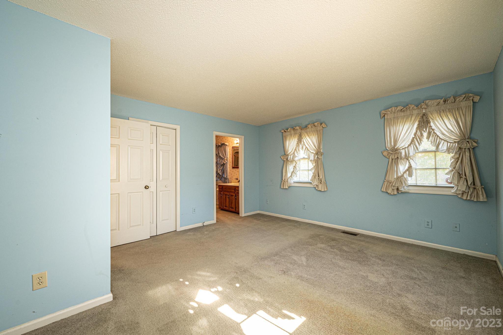 837 White Plains Road Hiddenite, NC 28636 - Photo 15 of 46 an empty room with windows