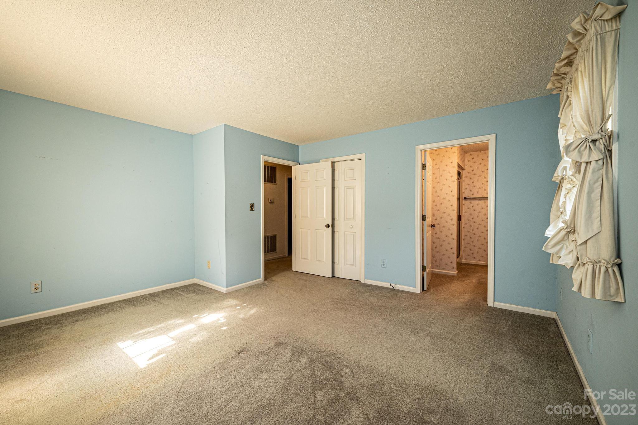 837 White Plains Road Hiddenite, NC 28636 - Photo 16 of 46 an empty room with windows