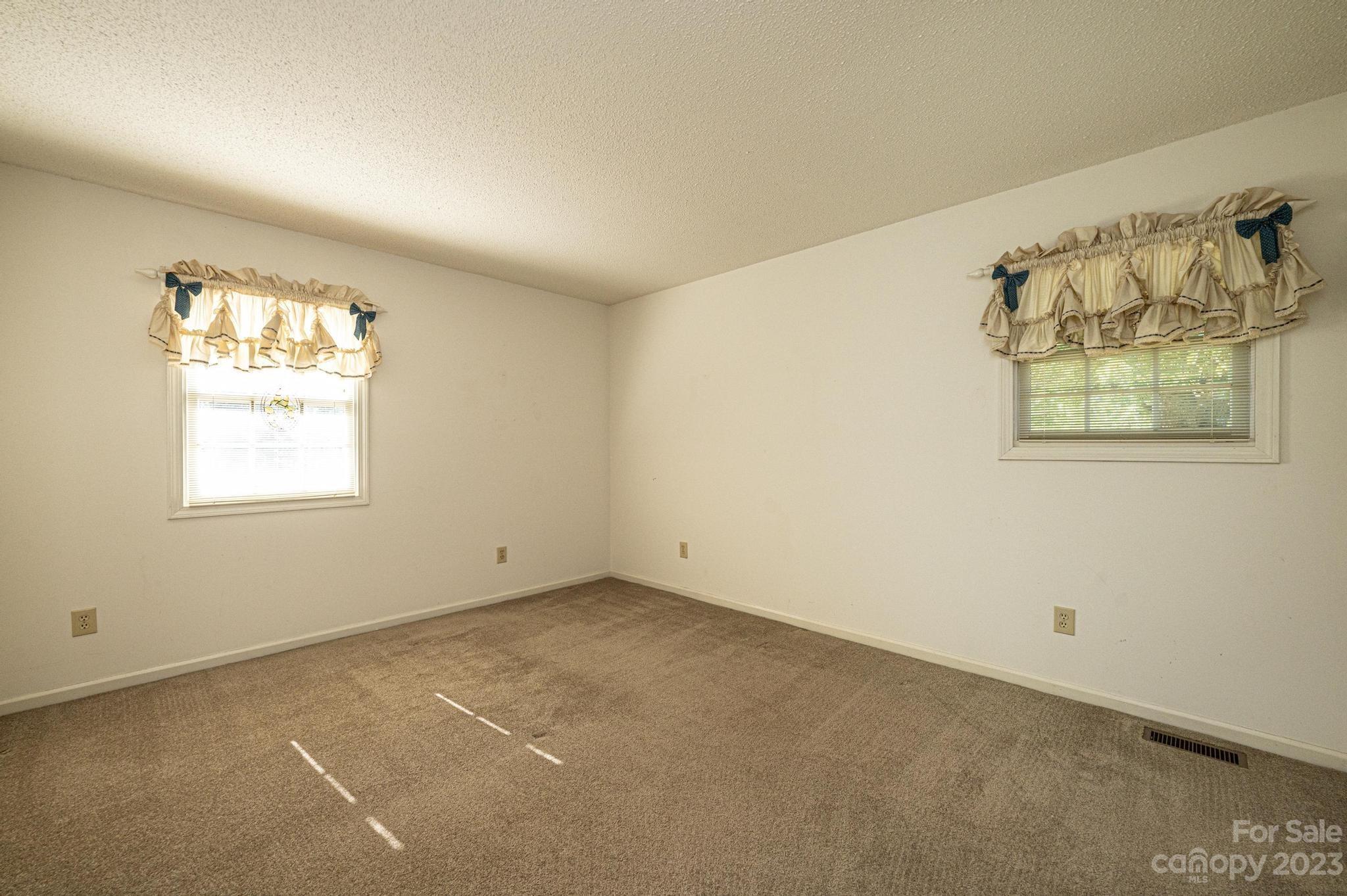 837 White Plains Road Hiddenite, NC 28636 - Photo 20 of 46 an empty room with windows