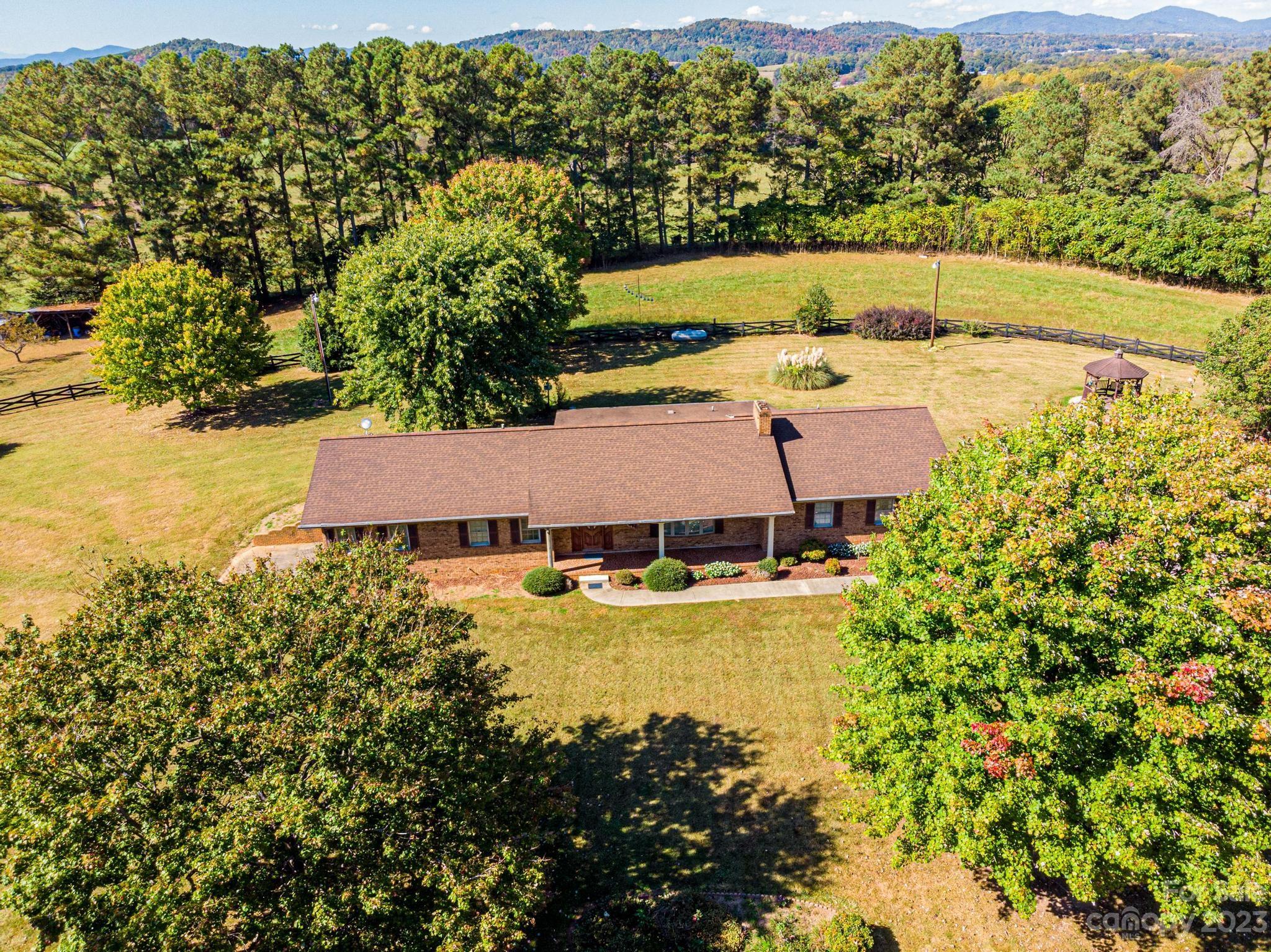 837 White Plains Road Hiddenite, NC 28636 - Photo 46 of 46 a aerial view of a house with swimming pool garden and patio