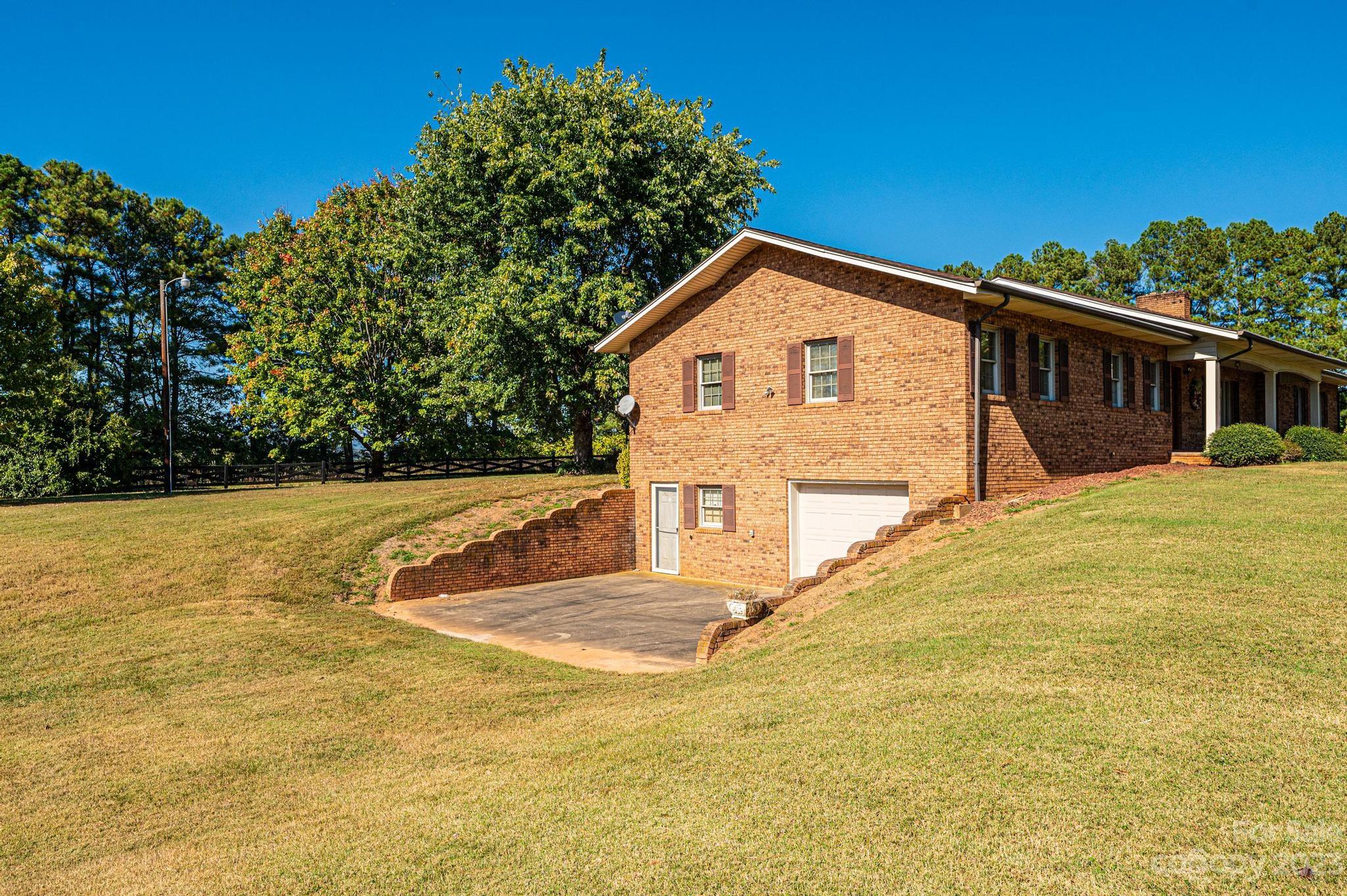 837 White Plains Road Hiddenite, NC 28636 - Photo 6 of 46 a view of house with yard and trees in the background