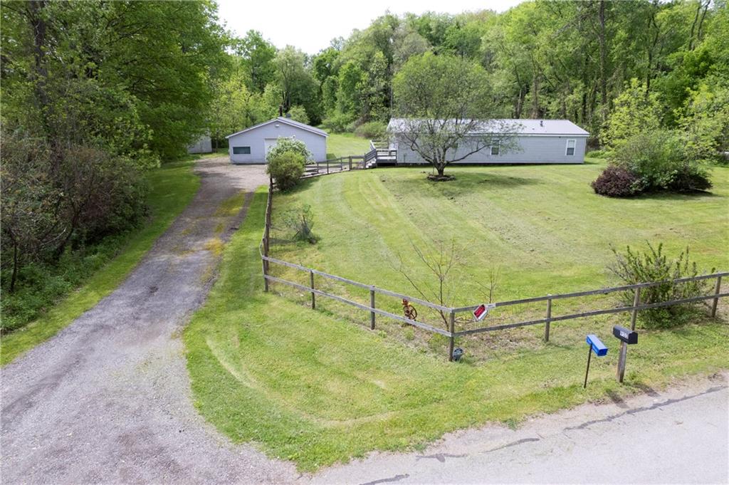 9133 South Watson Run Road Meadville, PA 16335 - Photo 1 of 45 a backyard of a house with yard and outdoor seating