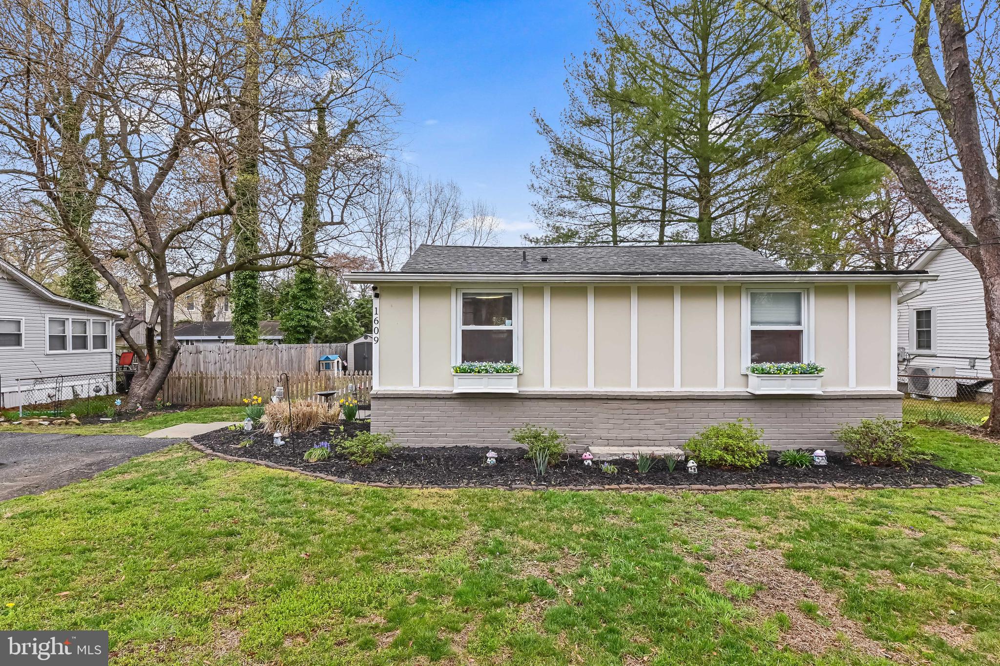 1609 Rockhold Road Edgewater, MD 21037 - Photo 1 of 35 a front view of a house with garden