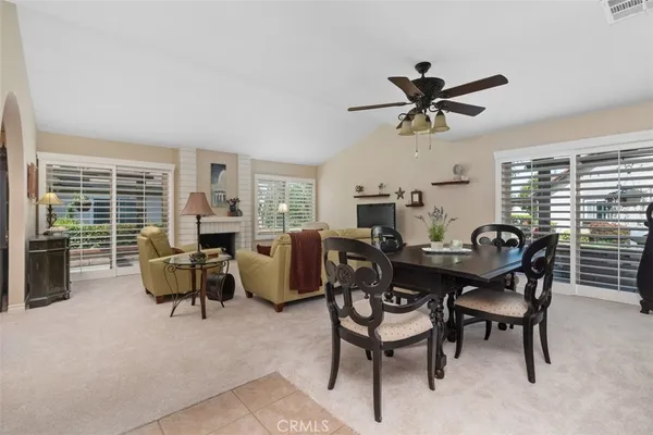 a dining room with furniture and window