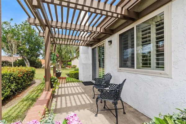 a view of a porch with wooden floor