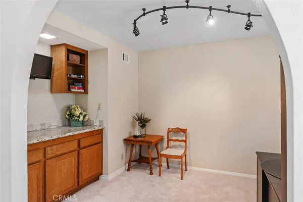 a kitchen with a table and chairs in it