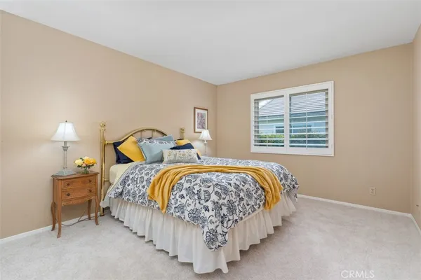a bedroom with a bed and dresser