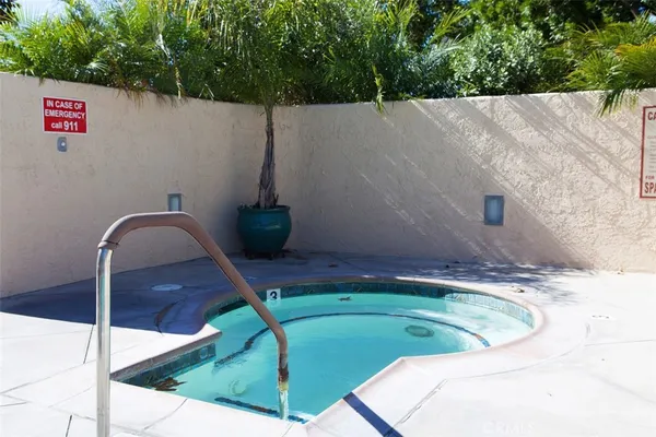 a view of a swimming pool with a patio
