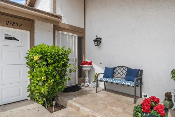 a bench sitting in front of a house