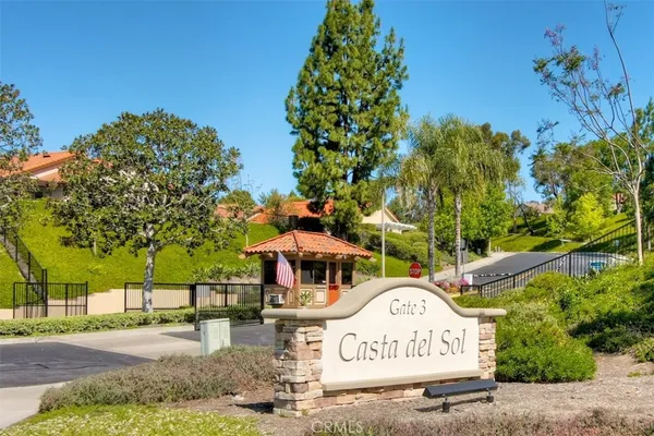 a view of a park that has a sign board