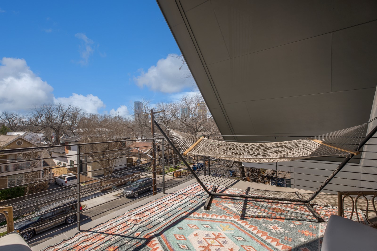 1410 East 3rd Street, Unit A Austin, TX 78702 - Photo 30 of 40 a view of a balcony with wooden floor