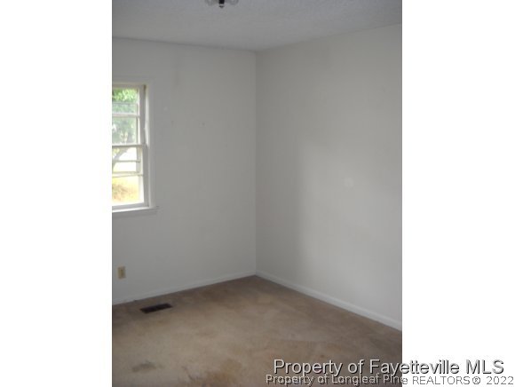 438 Lansdowne Road Fayetteville, NC 28314 - Photo 12 of 14 a view of an empty room with a window