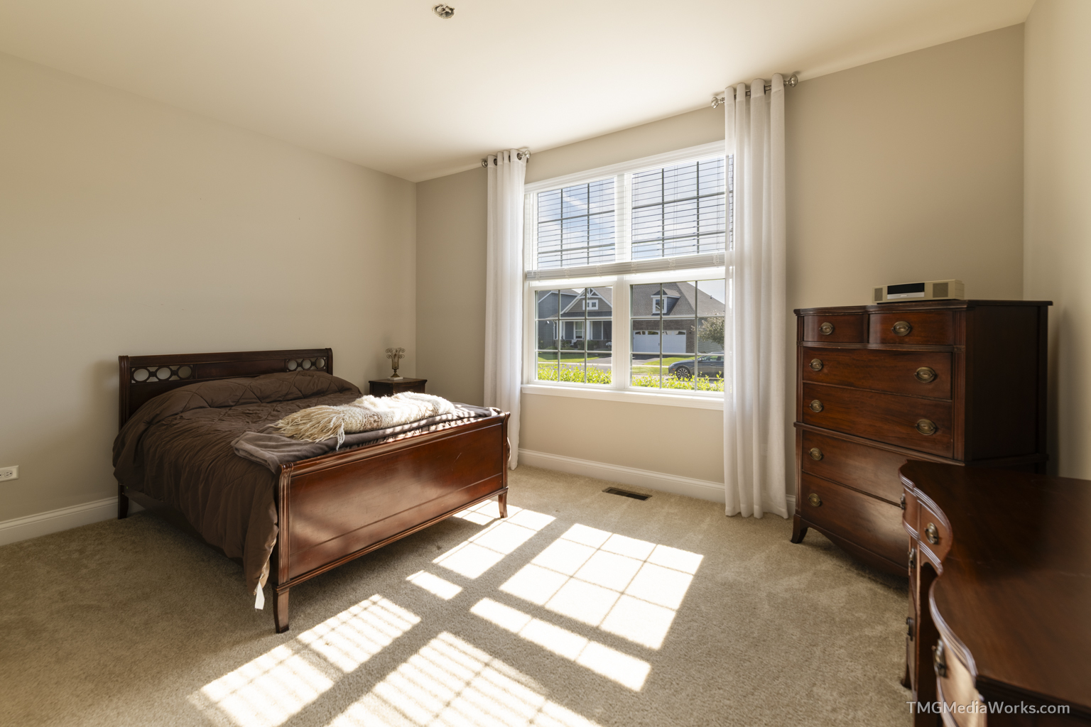 3336 Empress Drive Naperville, IL 60564 - Photo 35 of 57 a bed sitting in a bedroom next to a window