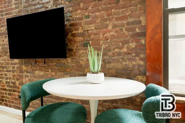 a dining room with table and chairs