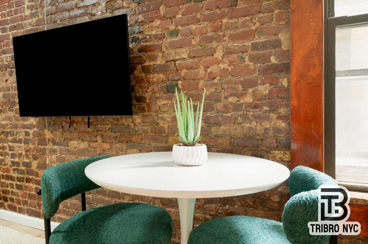 47 Market Street, Unit 3A Manhattan, NY 10002 - Photo 3 of 8 a dining room with table and chairs