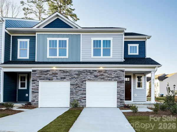 a front view of a house with yard