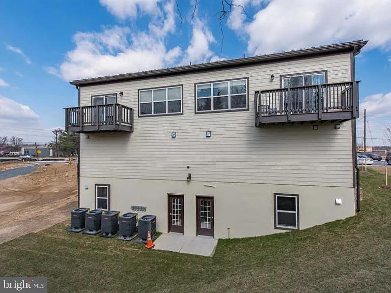 3303 Demirel Way, Unit D Ellicott City, MD 21042 - Photo 11 of 12 a view of a house with a backyard