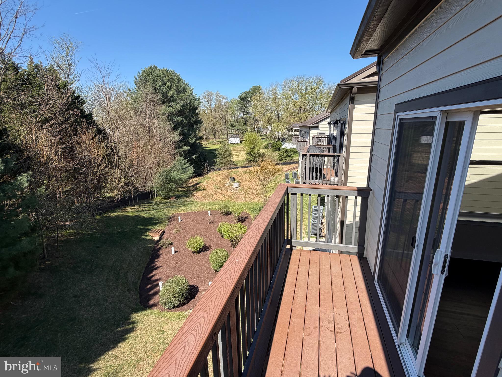 3303 Demirel Way, Unit D Ellicott City, MD 21042 - Photo 11 of 34 a view of balcony with wooden floor and outdoor seating